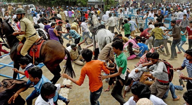 Police on horses lathicharging the public