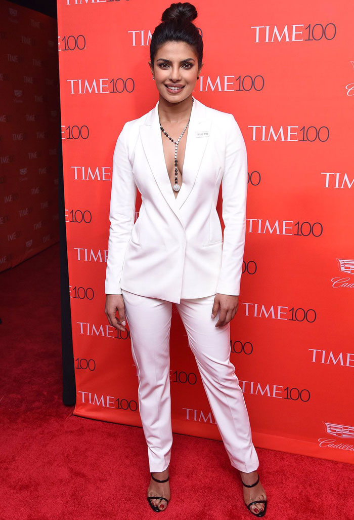 Priyanka Chopra dressed in a white suit with a revealing neckline