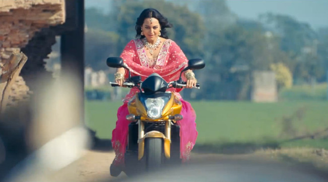 Sonakshi Sinha rides a bike