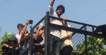 SRK climbs his house fence to wave out to the his fans